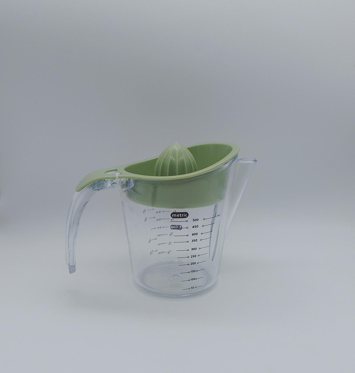 Exprimidor multifuncional de cítricos con taza medidora