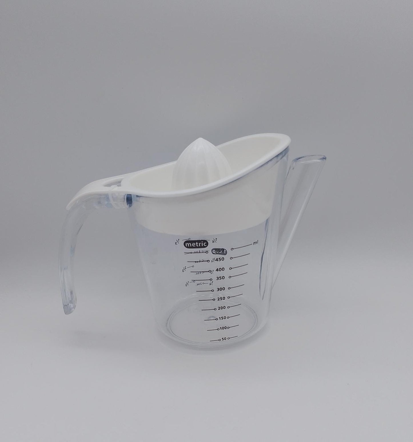 Exprimidor multifuncional de cítricos con taza medidora